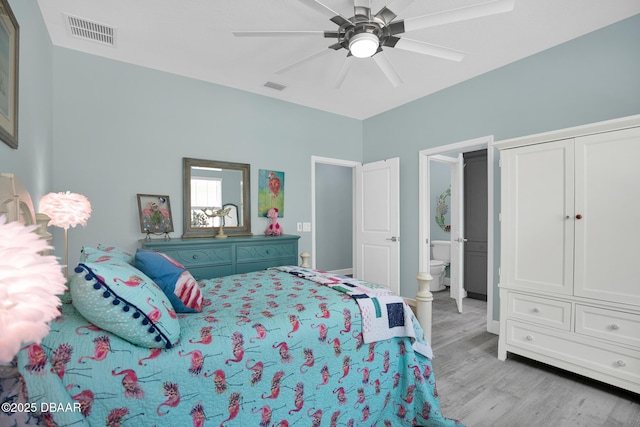 308 Low Tide Ln, Daytona Beach, FL 32124 - bedroom featuring light wood finished floors, a ceiling fan, and connected bathroom