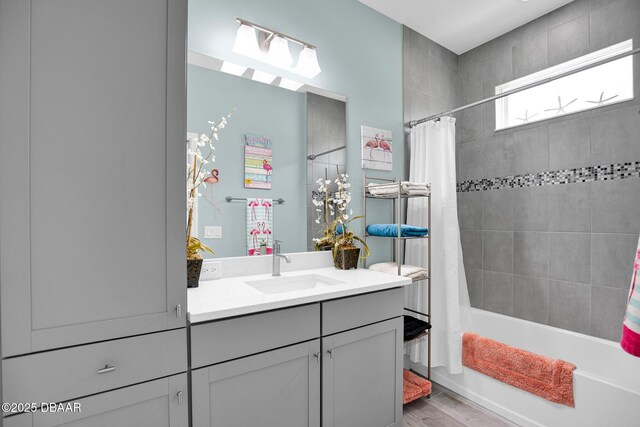 308 Low Tide Ln, Daytona Beach, FL 32124 - bathroom featuring vanity, shower / tub combo, and wood finished floors