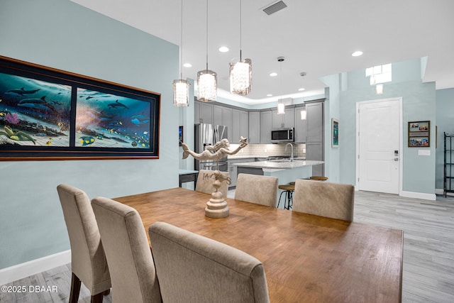 308 Low Tide Ln, Daytona Beach, FL 32124 - dining area featuring recessed lighting and light wood-style floors