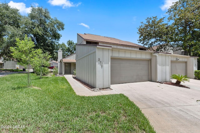 view of property exterior with a garage and a lawn