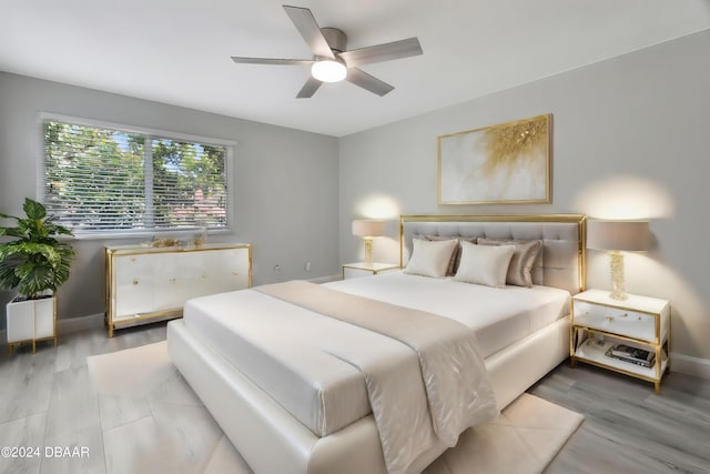 bedroom featuring light wood-type flooring and ceiling fan