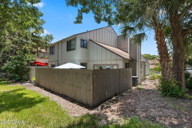 view of side of property featuring cooling unit