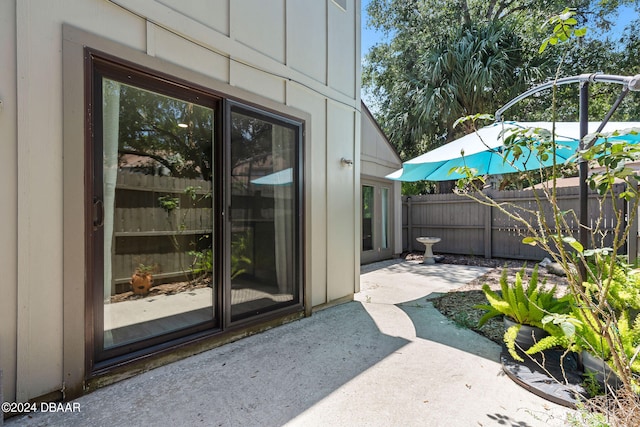 doorway to property with a patio