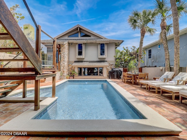 view of pool featuring a patio