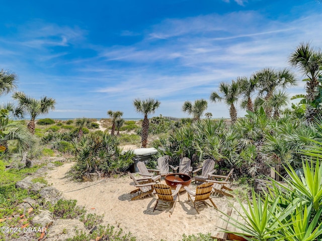 view of yard with a fire pit