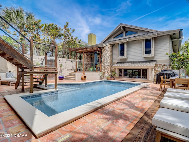 view of swimming pool with a patio