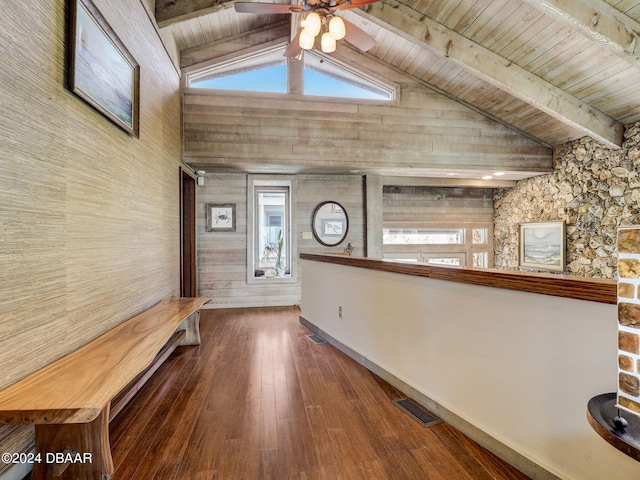 corridor with hardwood / wood-style floors, plenty of natural light, wood walls, and wooden ceiling