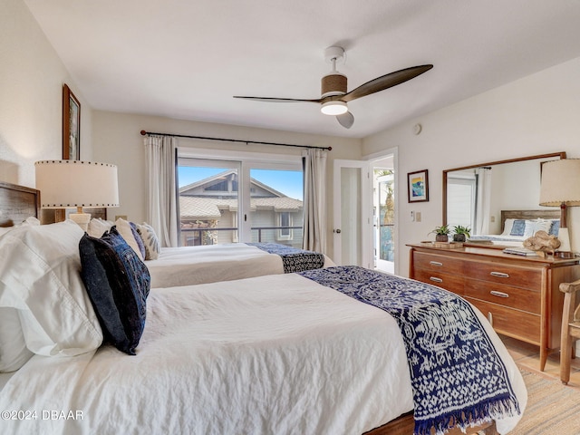 bedroom featuring access to outside, wood-type flooring, and ceiling fan