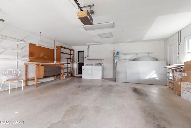 garage featuring washer and clothes dryer and a garage door opener