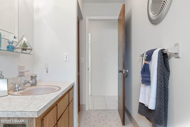 bathroom with tile patterned flooring and vanity