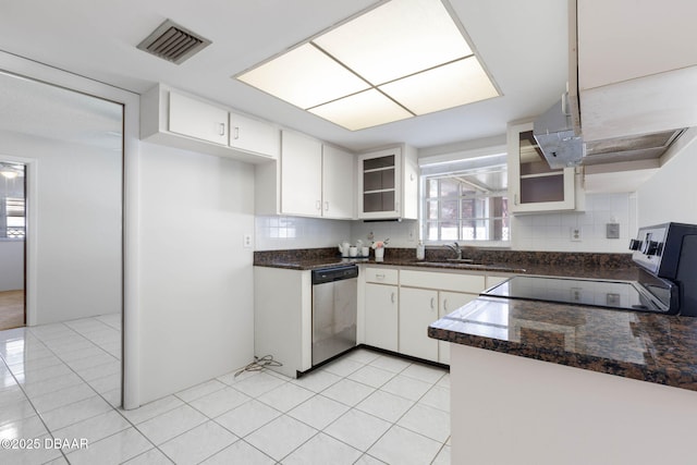 kitchen with backsplash, dishwasher, white cabinets, and sink