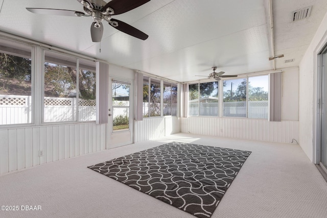 sunroom / solarium with ceiling fan