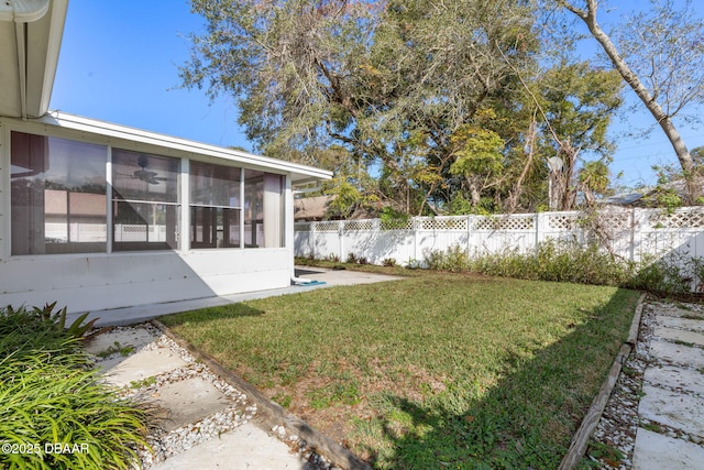 view of yard with a sunroom