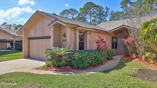 ranch-style home featuring a garage and a front yard