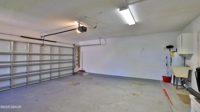 garage featuring a sink and a garage door opener
