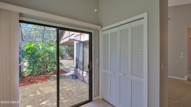 entryway featuring light tile patterned flooring