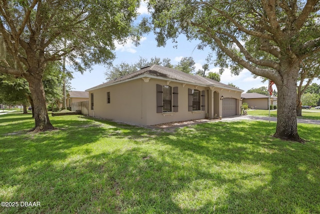 view of front of home with a front lawn and a garage