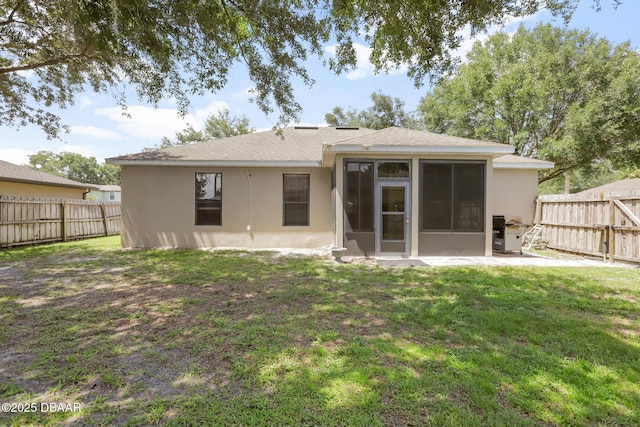 back of house featuring a yard