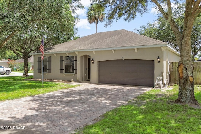 single story home featuring a front yard and a garage