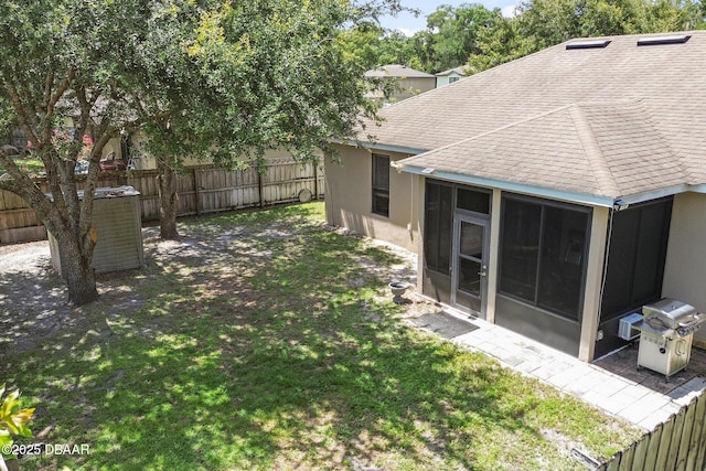 view of yard featuring a sunroom