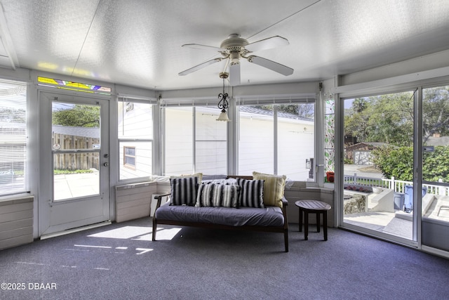 sunroom with ceiling fan