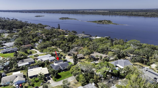 drone / aerial view featuring a residential view and a water view