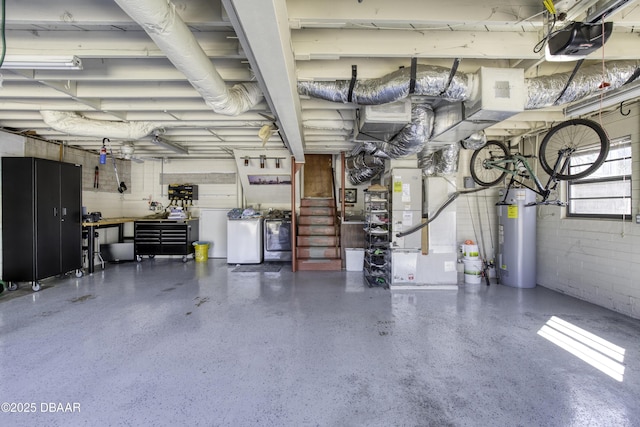 garage with concrete block wall, a garage door opener, and water heater