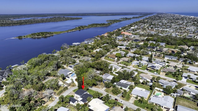 drone / aerial view with a residential view and a water view