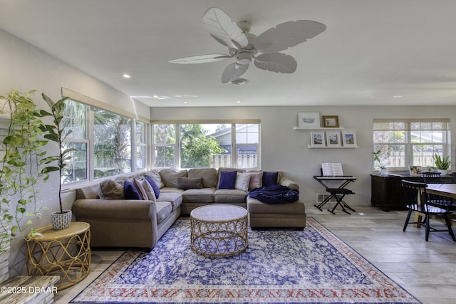 living area with visible vents, recessed lighting, a ceiling fan, and wood finished floors