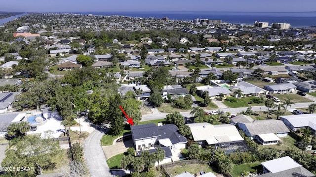 bird's eye view with a residential view and a water view