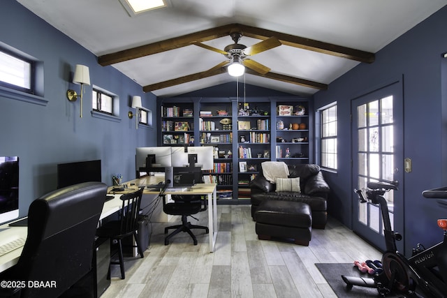 office area featuring a ceiling fan, lofted ceiling with beams, wood finished floors, and a wealth of natural light