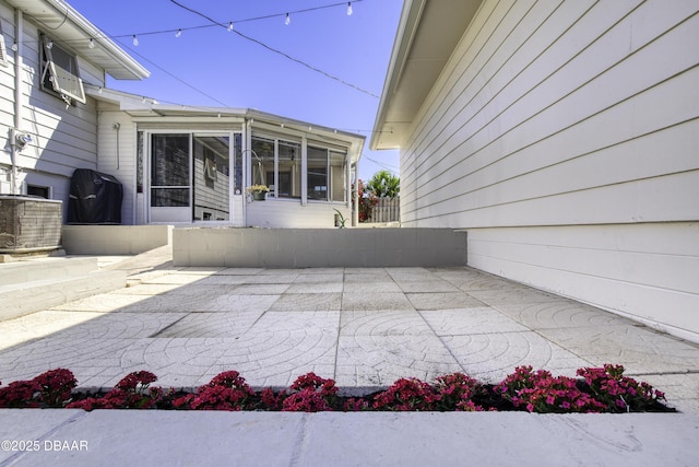 view of patio / terrace with a sunroom