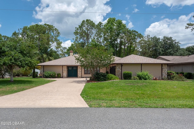 31 Pennsylvania Ln, Palm Coast, FL 32164 - view of front of house featuring stone siding, a front yard, a chimney, and concrete driveway