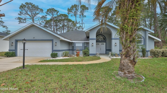 ranch-style house featuring a front yard and a garage