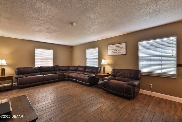 180 Willow Run, Ormond Beach, FL 32174 - living area with a textured ceiling, wood finished floors, plenty of natural light, and baseboards
