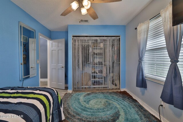 180 Willow Run, Ormond Beach, FL 32174 - bedroom featuring ceiling fan, baseboards, and a closet