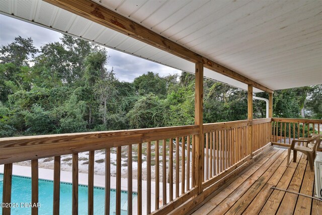 180 Willow Run, Ormond Beach, FL 32174 - wooden terrace featuring an outdoor pool