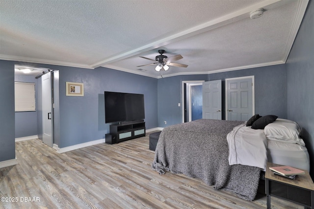 180 Willow Run, Ormond Beach, FL 32174 - bedroom with a textured ceiling, light wood-style floors, baseboards, ornamental molding, and ceiling fan