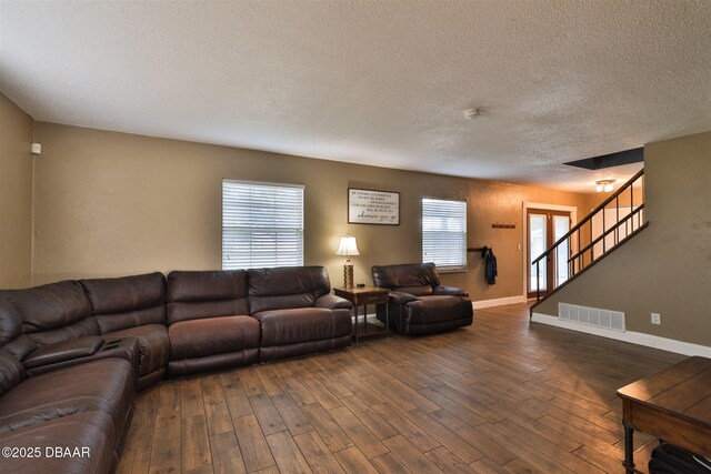 180 Willow Run, Ormond Beach, FL 32174 - living area featuring wood finished floors, a textured ceiling, stairway, and baseboards