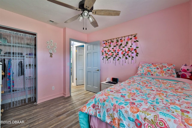 180 Willow Run, Ormond Beach, FL 32174 - bedroom with wood finished floors, baseboards, a closet, and ceiling fan
