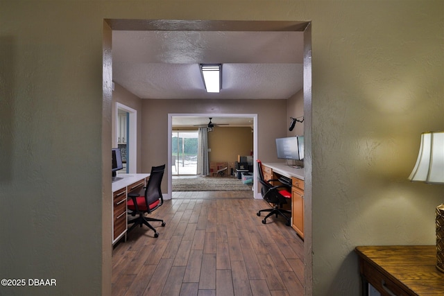 180 Willow Run, Ormond Beach, FL 32174 - office featuring dark wood-style flooring, a textured wall, a textured ceiling, and baseboards