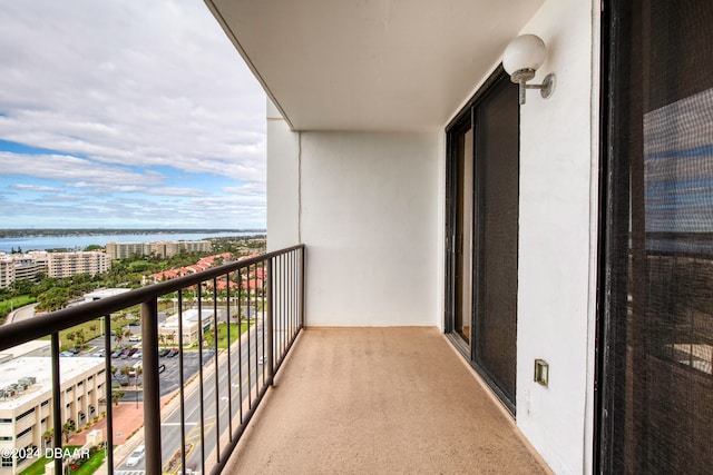 balcony featuring a water view