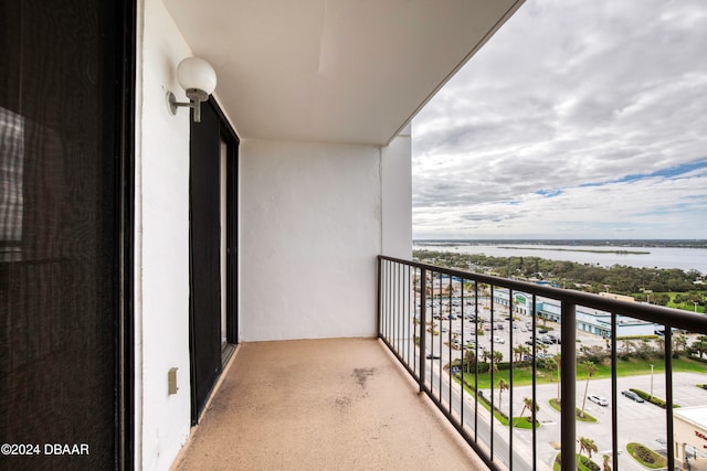 balcony featuring a water view