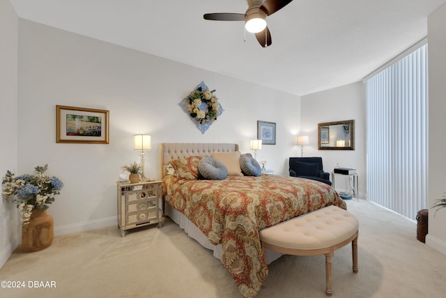 bedroom with light carpet and ceiling fan