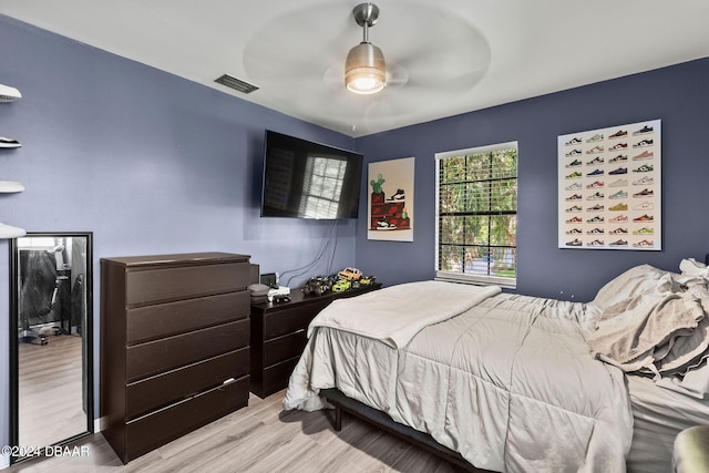 bedroom featuring ceiling fan and light wood-type flooring