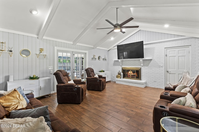 living room featuring a brick fireplace, dark hardwood / wood-style flooring, wood walls, and lofted ceiling with beams