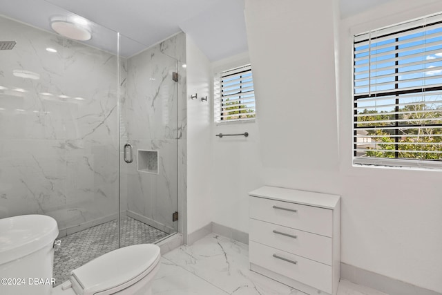 bathroom with toilet and a shower with shower door