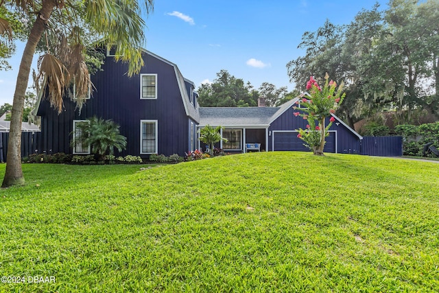 view of front of house featuring a garage and a front yard