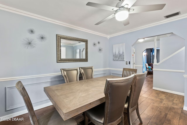 dining space featuring ornamental molding, dark hardwood / wood-style flooring, and ceiling fan