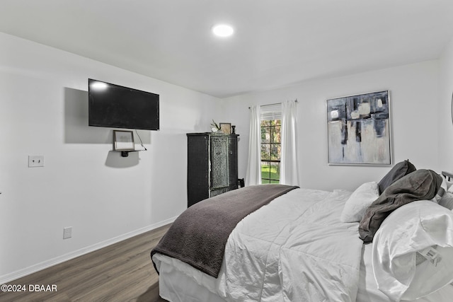 bedroom featuring dark wood-type flooring